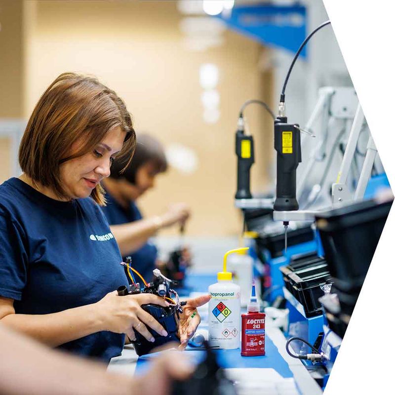 assembly-operator-working-on-complex-system