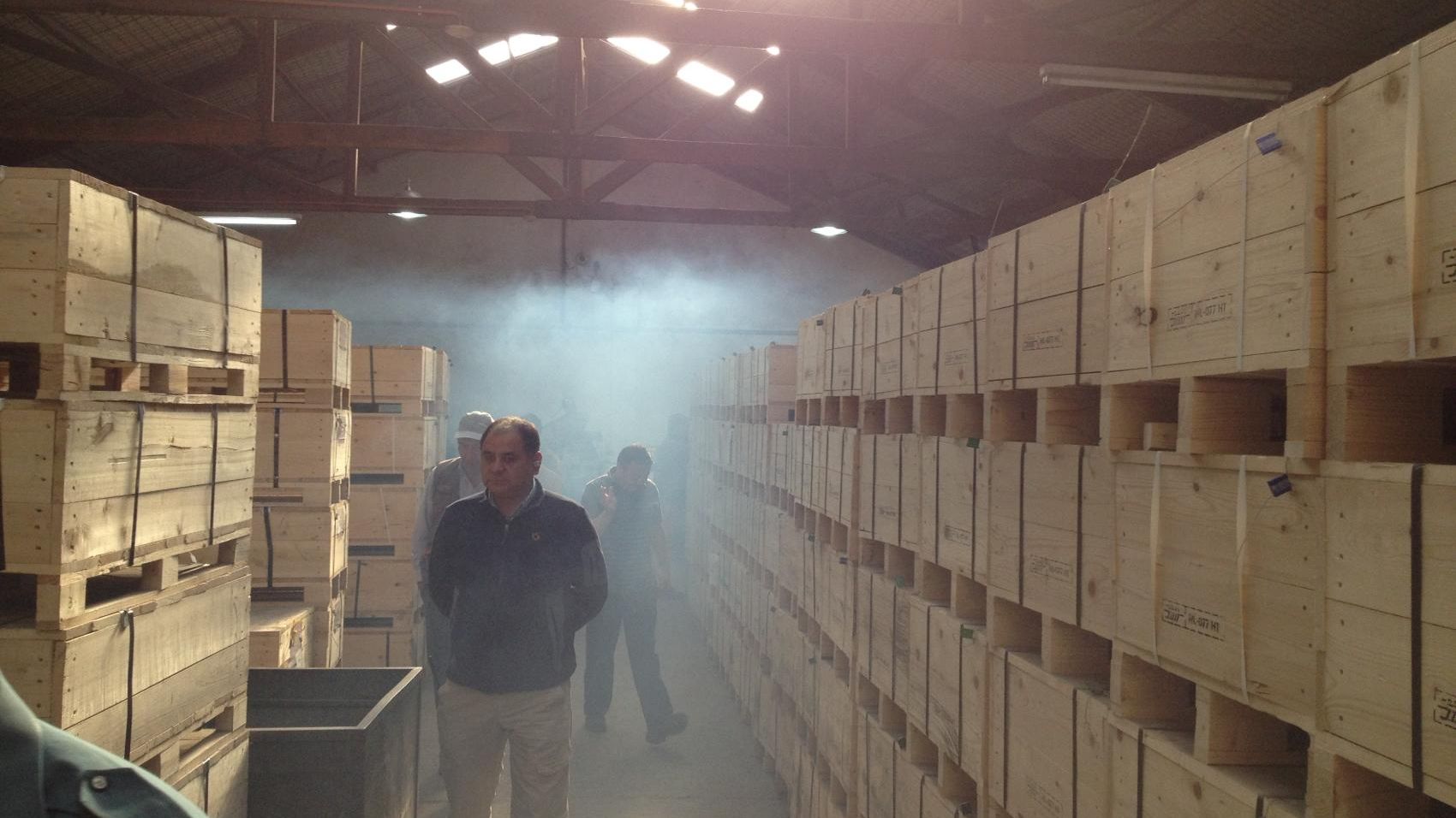 Demcon_hightech_men_warehouse_wooden_boxes