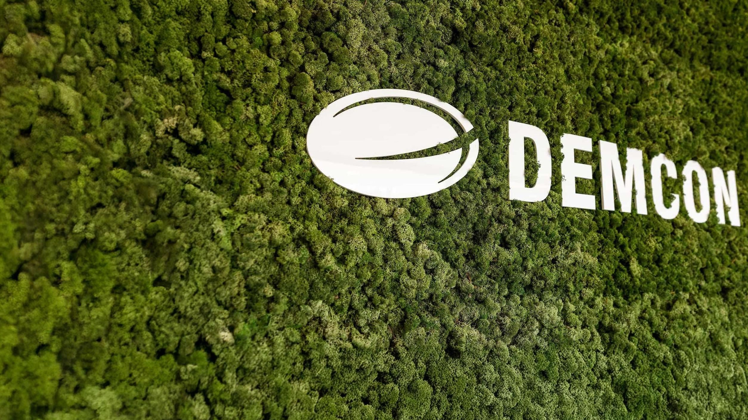Demcon logo on moss background