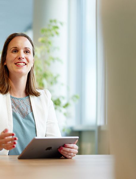 Demcon talking with ipad in hand