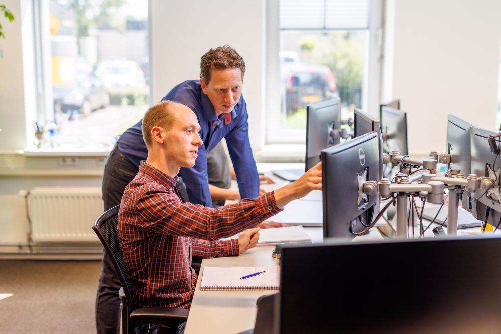 engineers behind desk